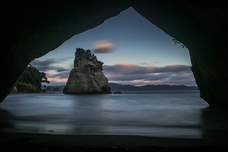 view from inside Cathedral Cove at sunset, north island, new zealand