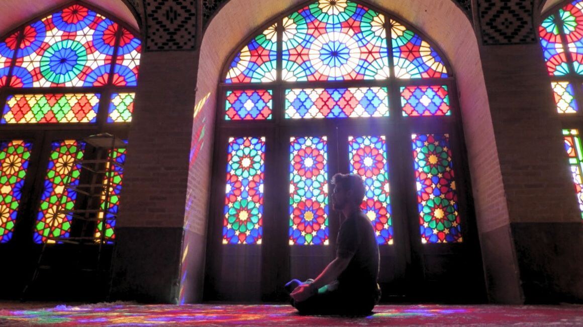 Will Hatton meditating inside the pink mosque in Shiraz, Iran