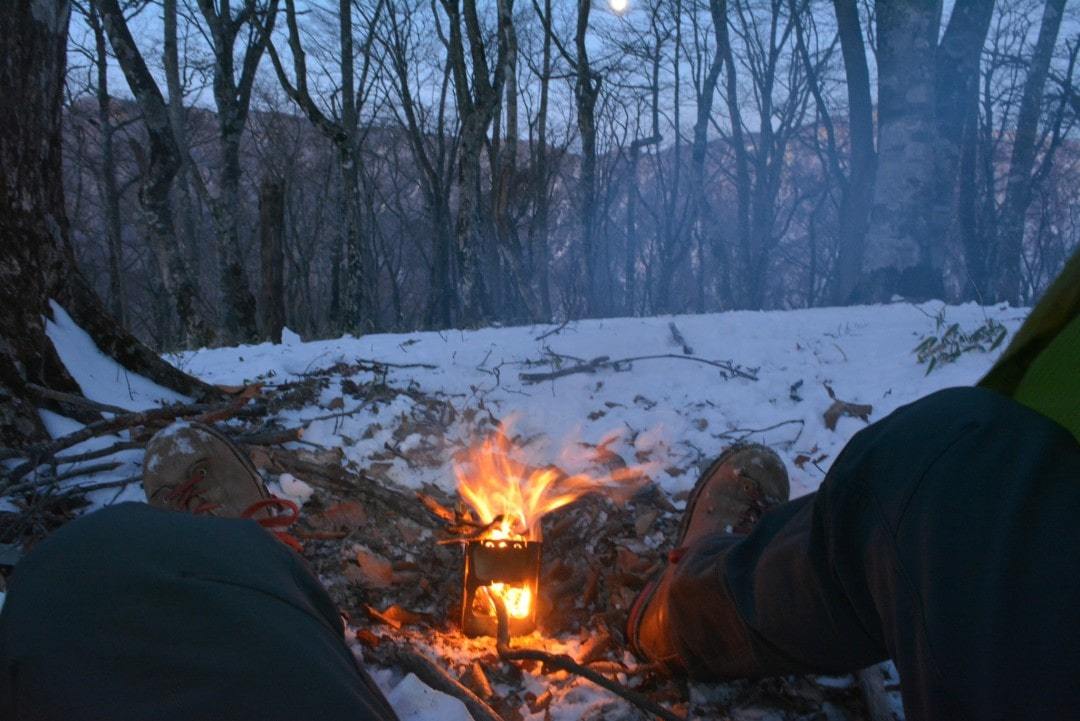 warming my feet with my ultralight camping stove