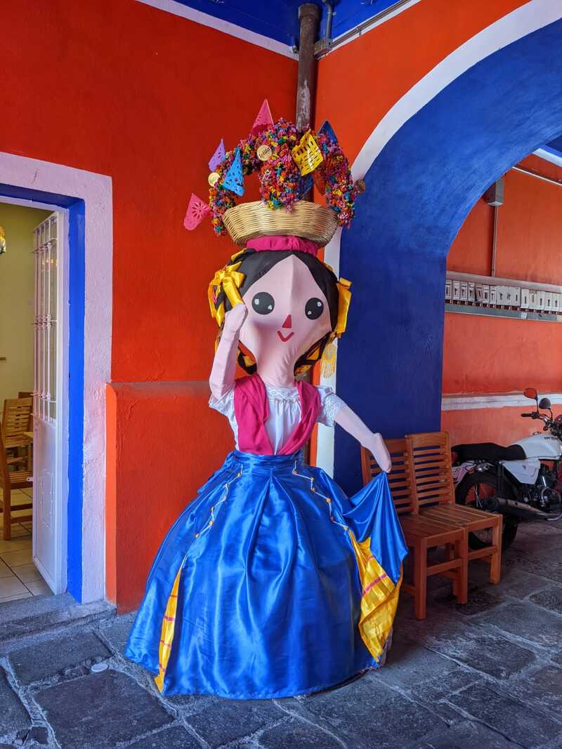 Big colourful doll puppet sculpture in Mexico.