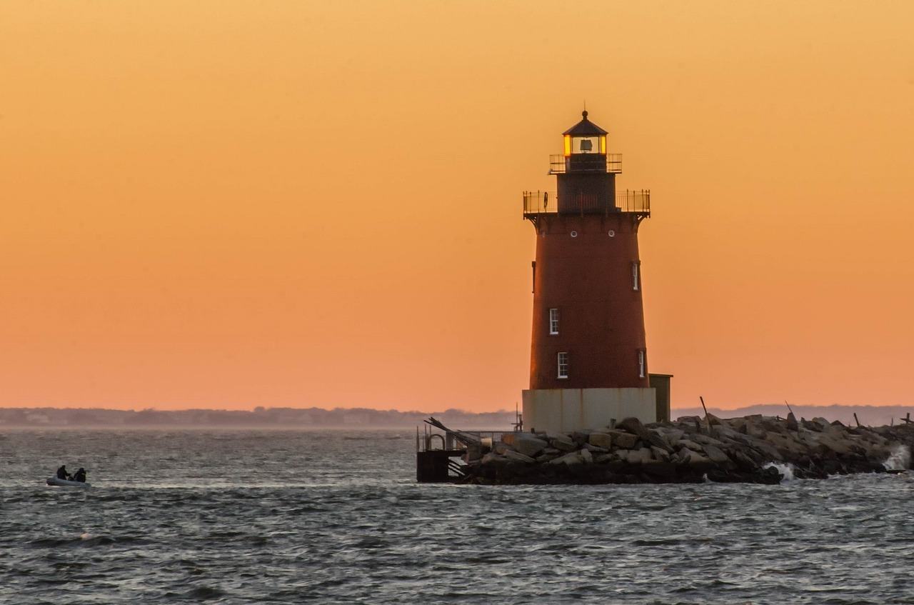 lighthouse on delaware coast sunset