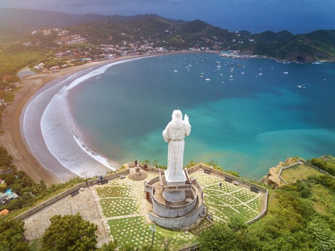 Is Nicaragua Safe 2023 Safety Guide   Shutterstock Nicaragua Jesus Beach People Green Blue Statue 690x517 