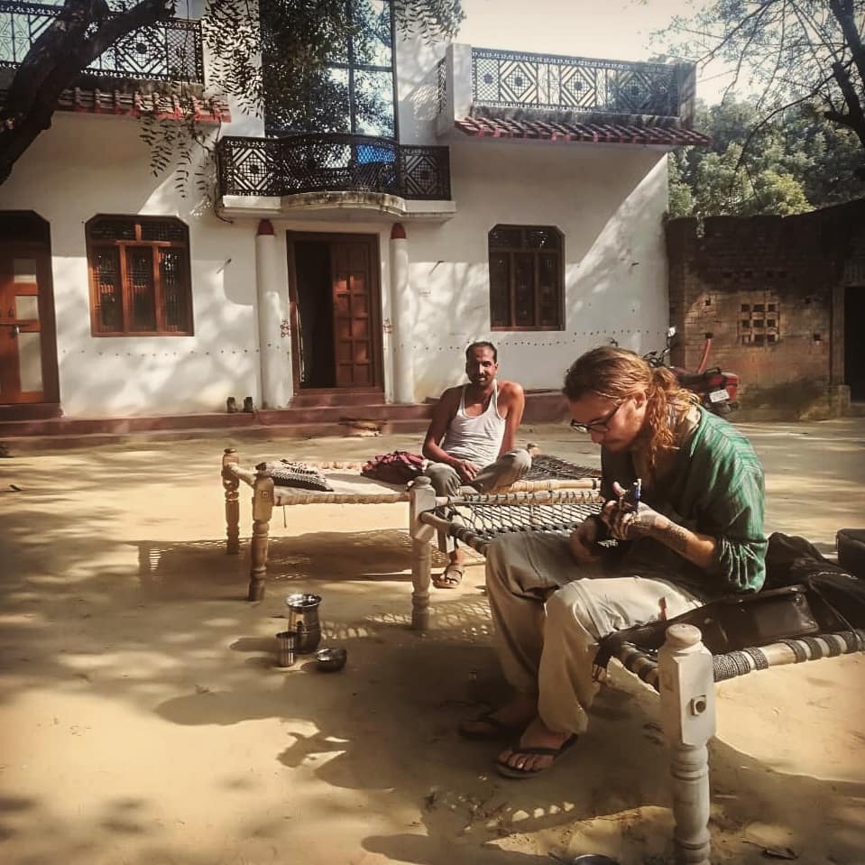 Playing a ukulele while traveling in India