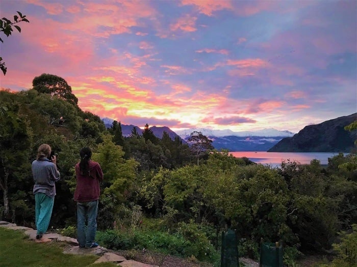 Two backpacking dirtbags enjoying a sunset in New Zealand