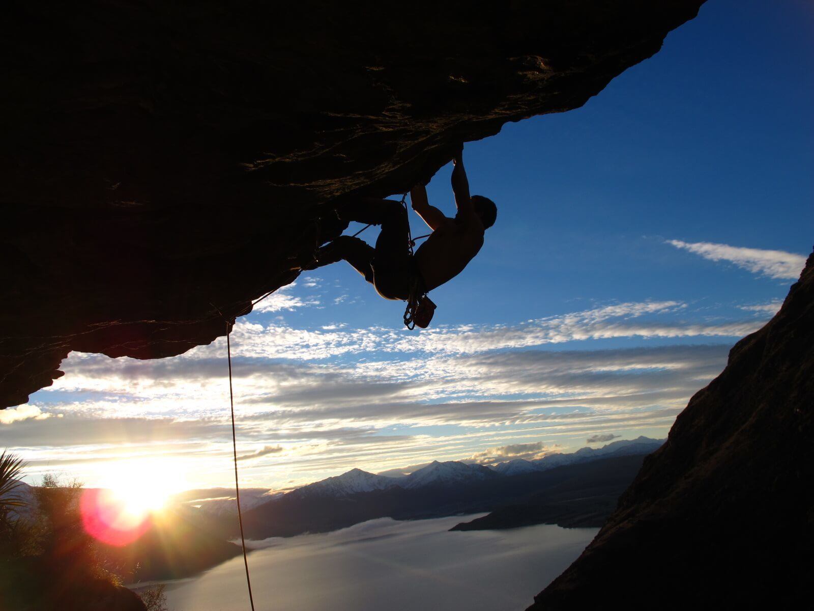 A man on a self-drive holiday of South Island rock climbing in Queenstown