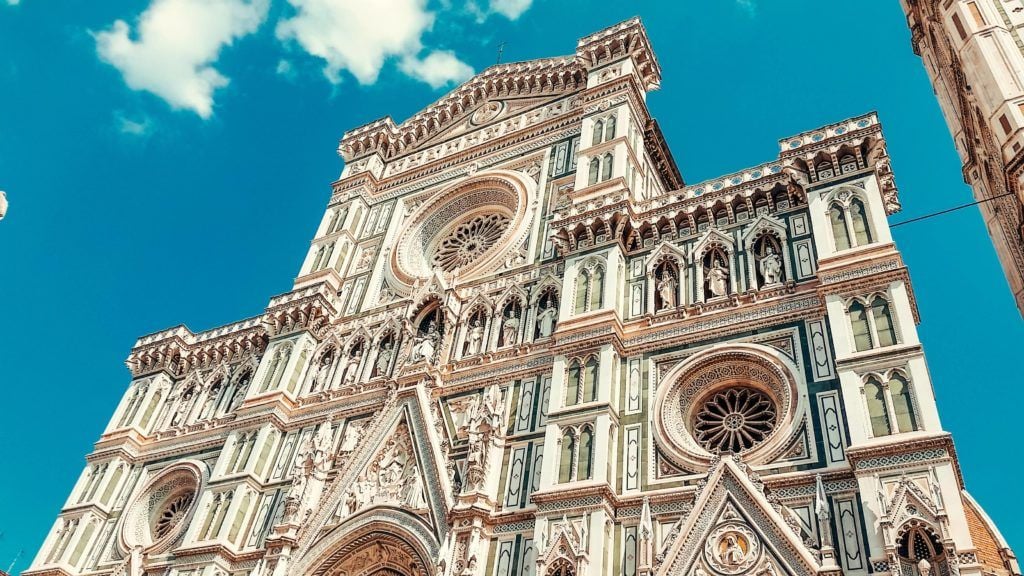 a intricately designed white church in florence italy