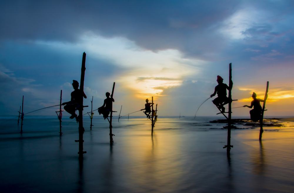 Photographing the famous stilt fishermen while on a south Sri Lanka itinerary tour