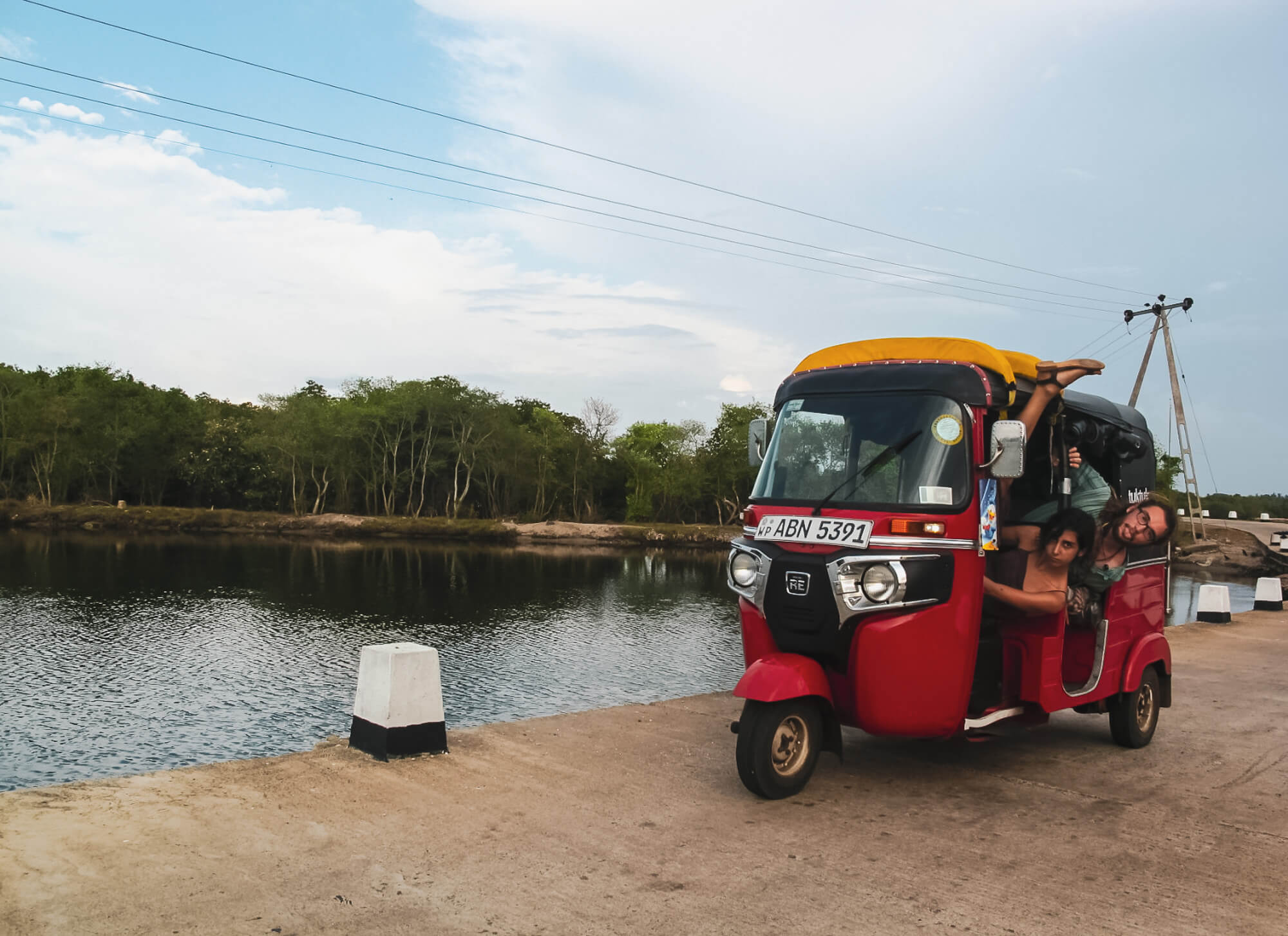 Two backpackers in their tuk-tuk rental in Sri Lanka - the best way to travel