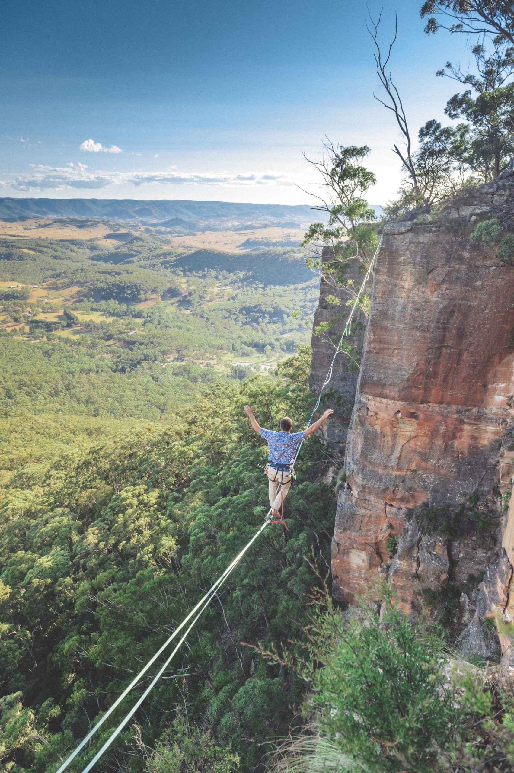 An Australian adventurer highlining in the Blue Mountains