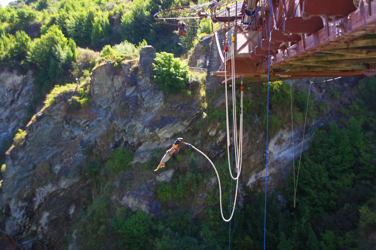 A backpacker in New Zealand crosses bungee jumping of his bucket list