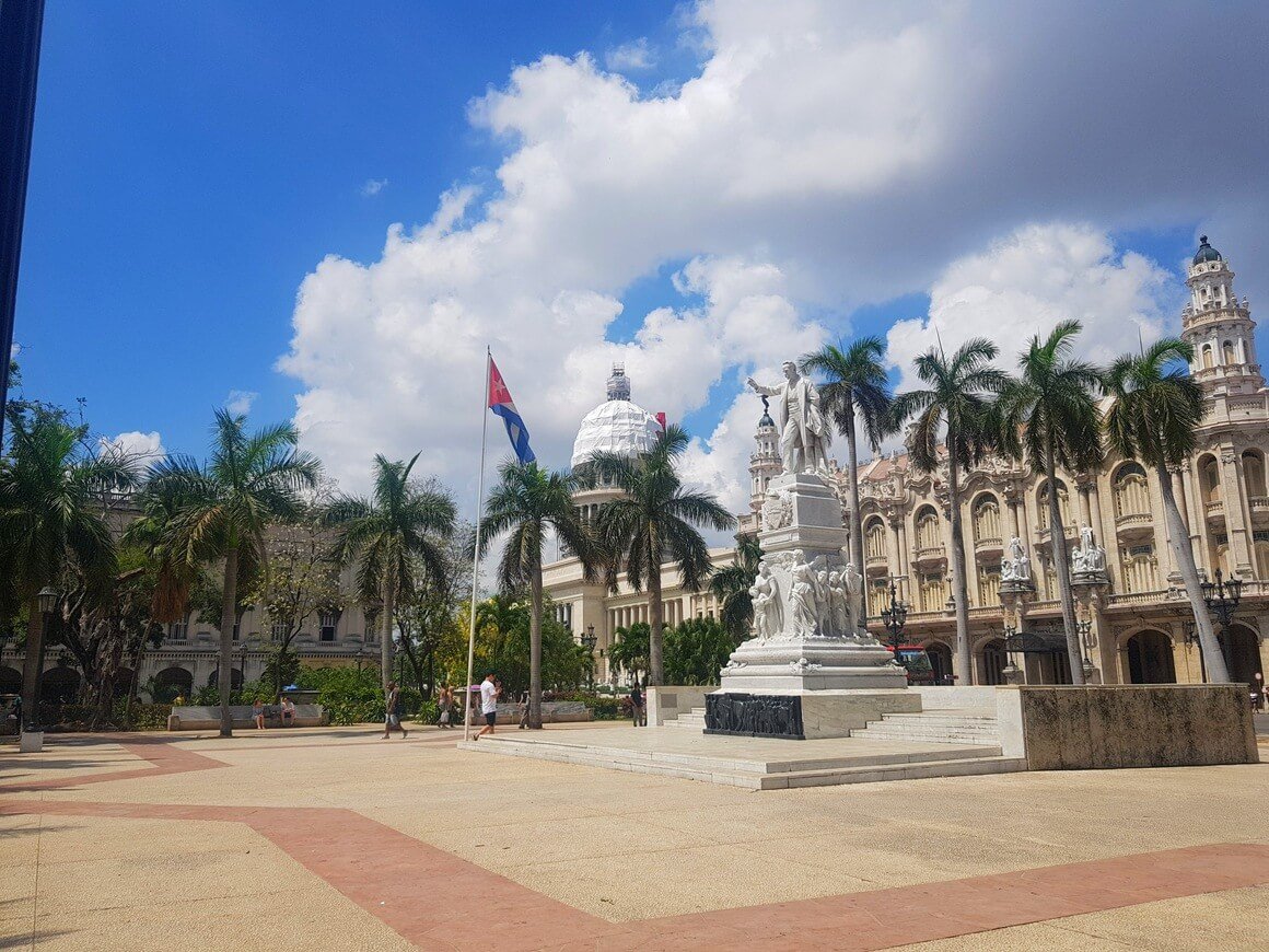 Statue of Jose Marti in the Parque Central with the Capitol National de Cuba behind in Havana