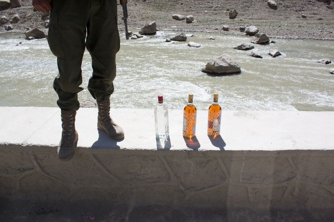 Three bottles of alcohol and a soldier.