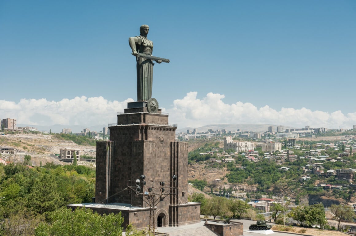 mother of armenia statue with a sword in hand over the city landscape