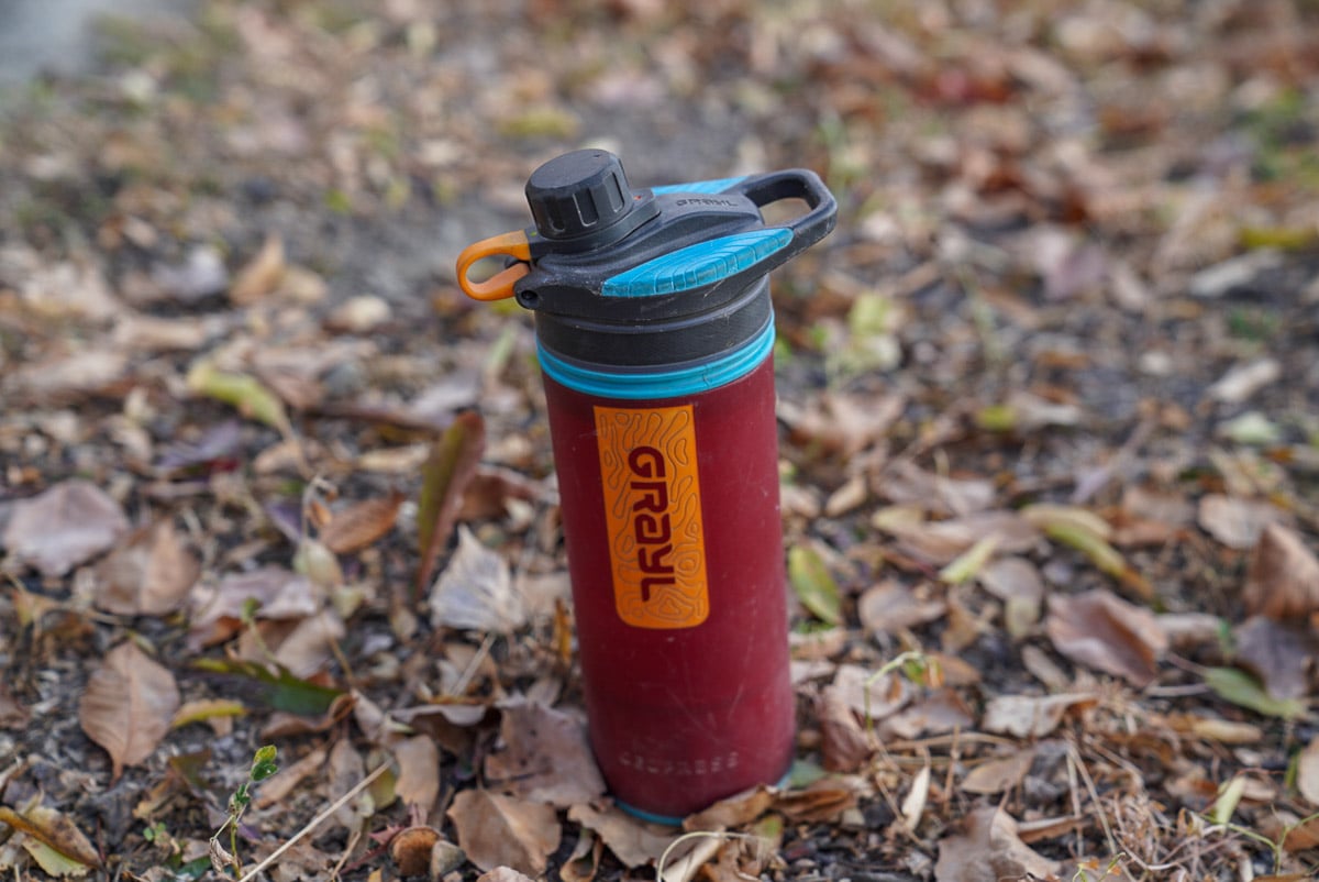 a grayl geopress waterbottle on the ground