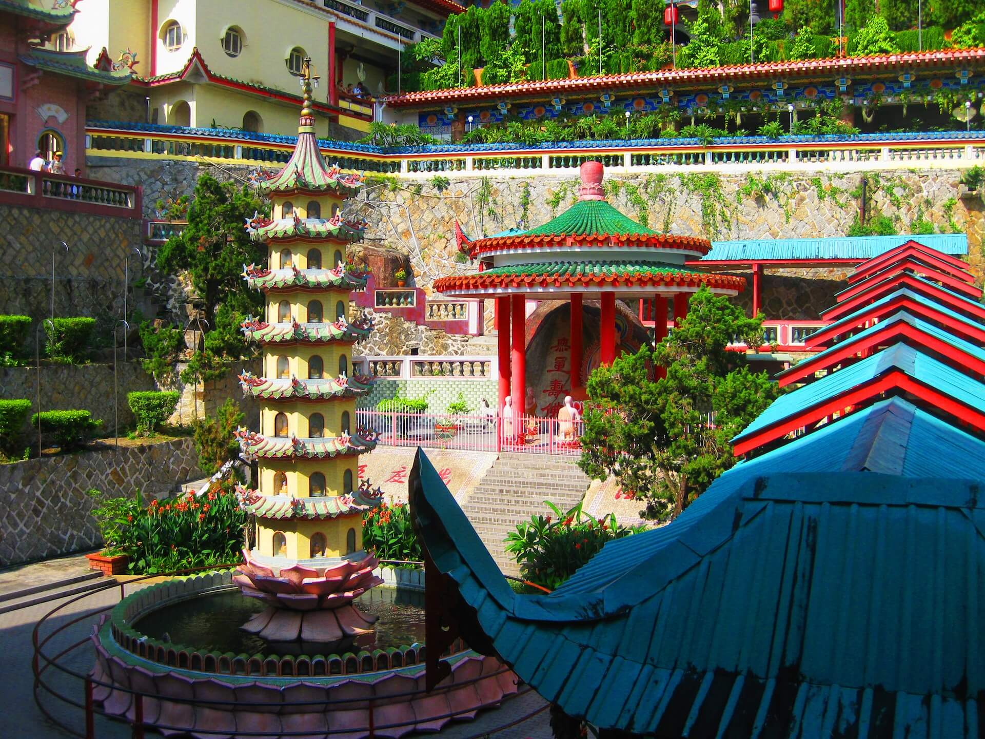 colorful awnings and sculptures in a buddhist temple in penang