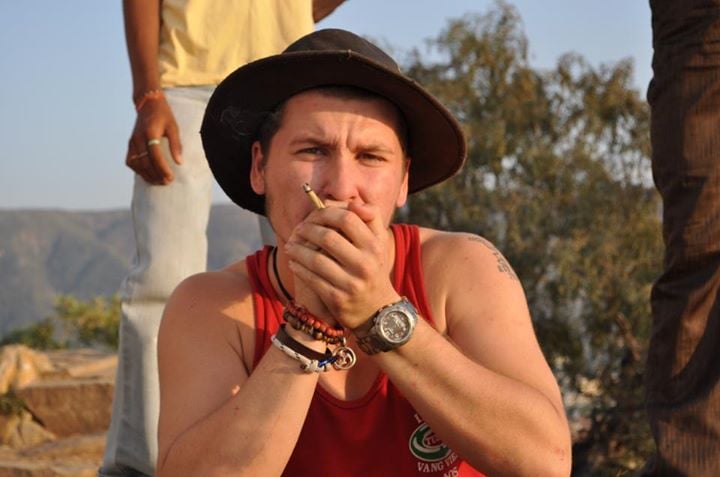 backpacker smoking a joint in india