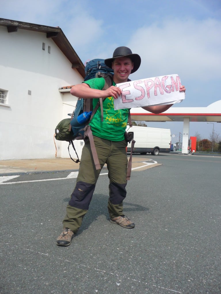 will hatton holding a sign getting ready to hitchhike into spain