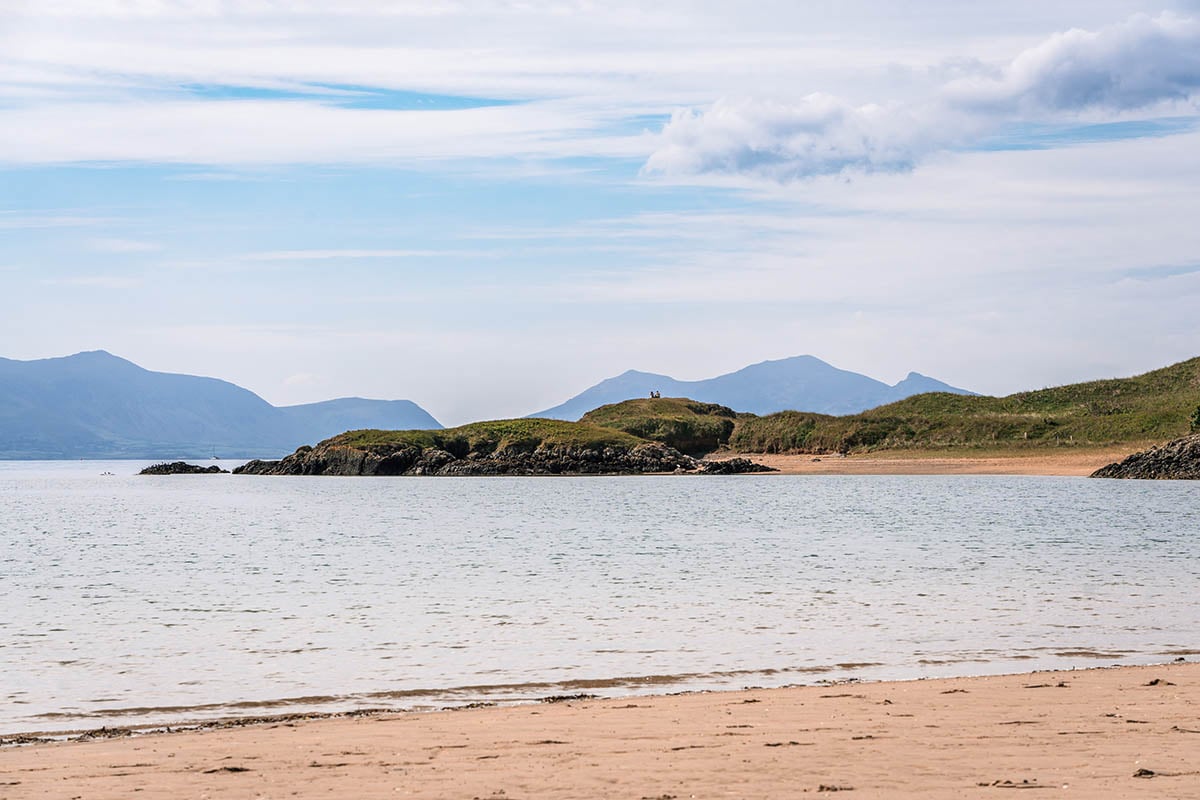 tbbteam, Wales, United Kingdom. A beach in Wales with mountains in the background.