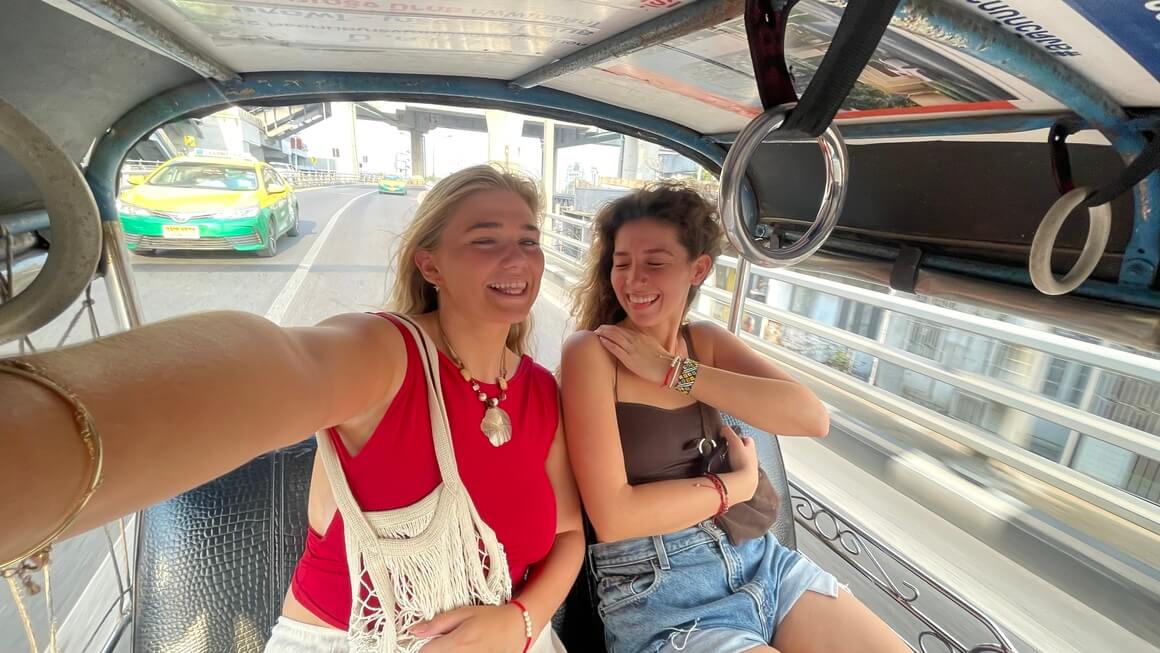 Girls on a tuk tuk ride in Bangkok, Thailand