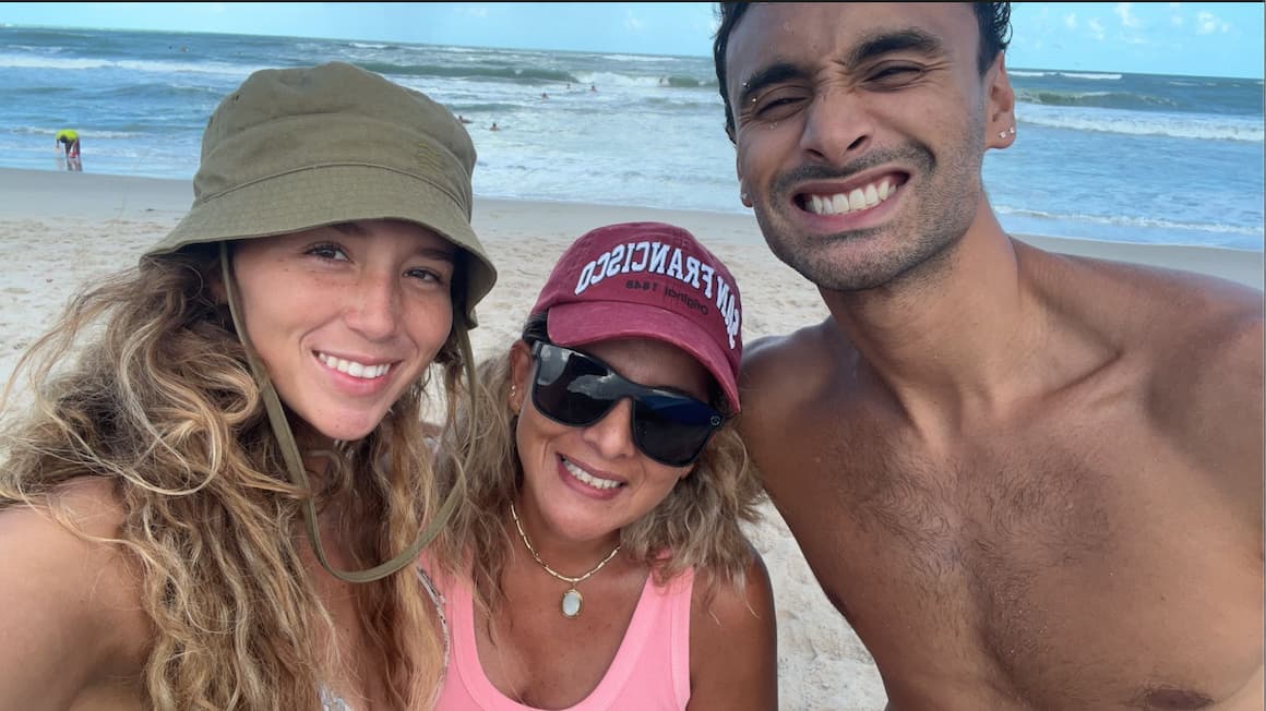 a family taking a selfie in front of the beach in Florida United States of America.