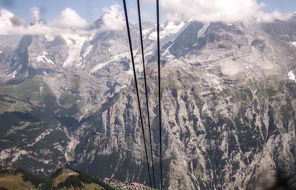 Taking a cable car in the Swiss Alps with the Eiger in the distance. Interlaken, Switzerland.