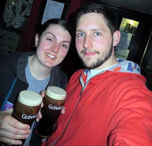 two people drinking Guinness in Dublin, Ireland inside a pub