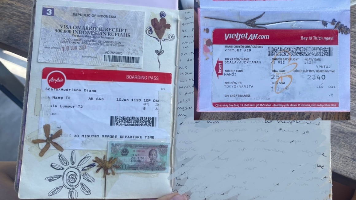 Plane tickets taped into a travel journal.