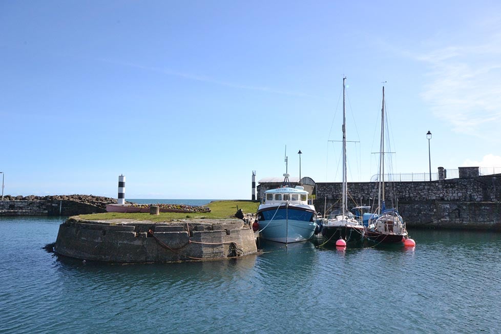 A harbour with stunning blue water in Northern Ireland.