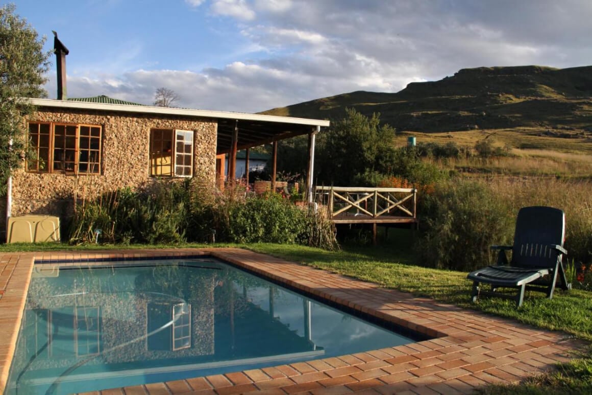 Sani Lodge Backpackers, with an outdoor pool and stone building. Drakensberg South Africa