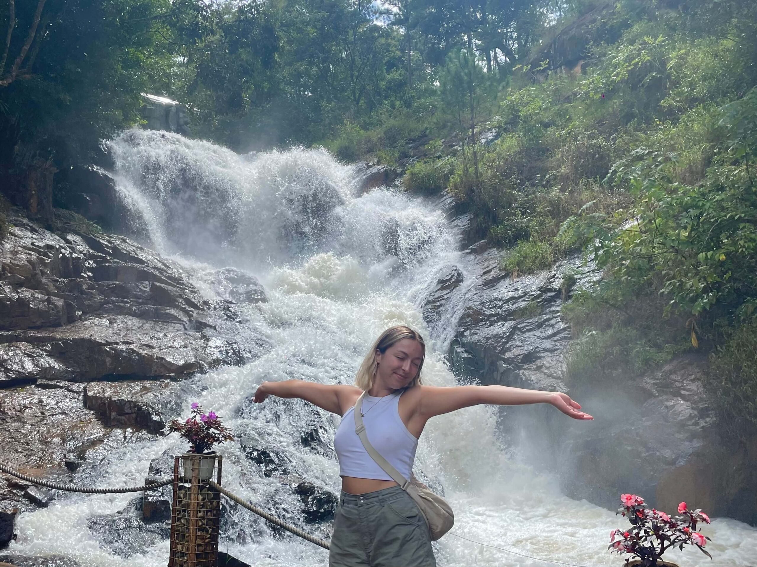 woman posing in front of datanla waterfall in da lat