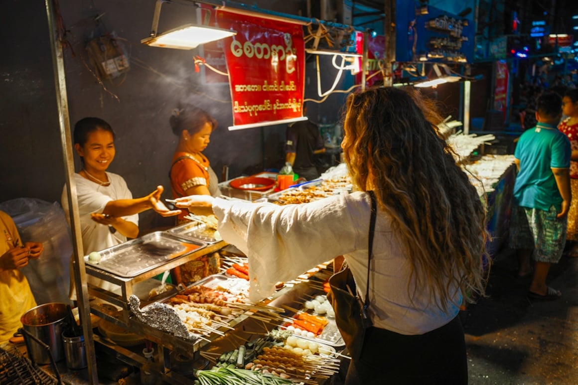 Amanda trying the elaborate and unique street food in Myanmar.