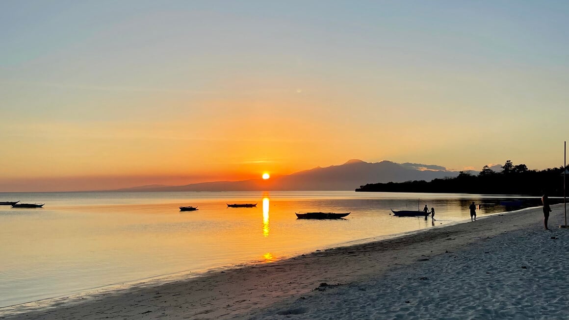 sunset on san juan beach in siquijor, philippines