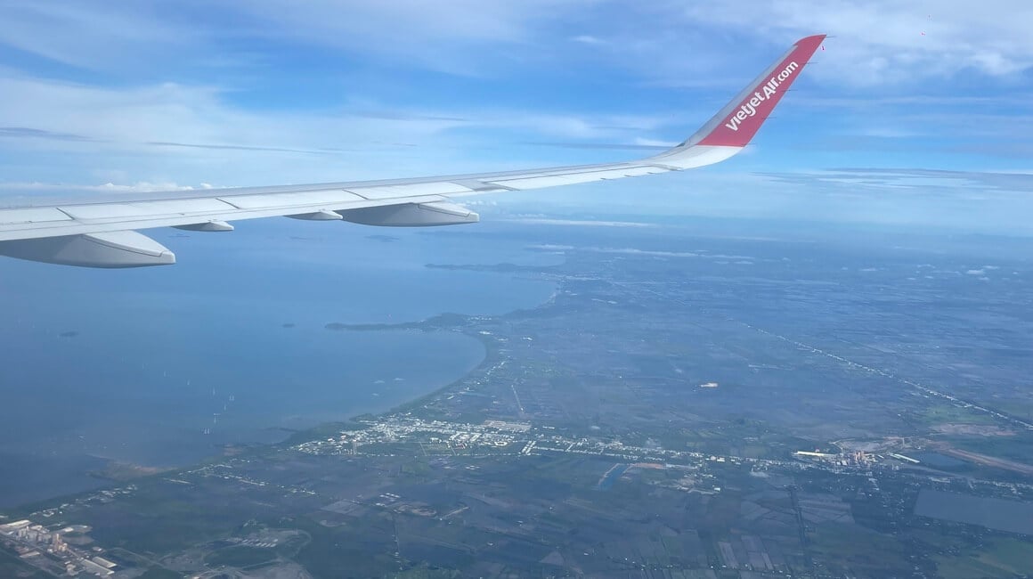 A shot of a Vietjet Air plane in the air in Vietnam