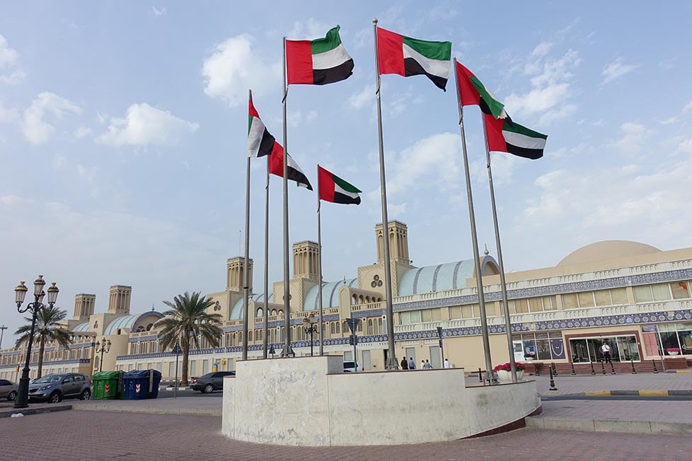 A round plinth with many UAE flags on it in Dubai, United Arab Emirates