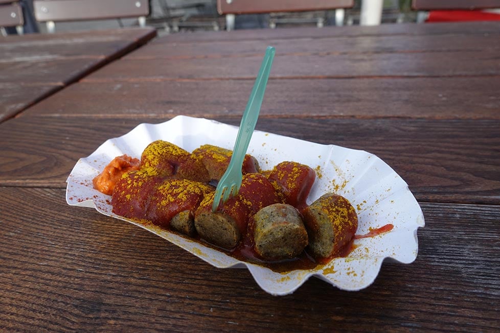 A paper bowl of currywurst in Berlin