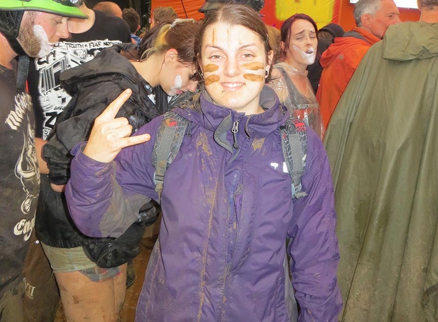 Nic covered in mud at a music festival in the United Kingdom in the rain