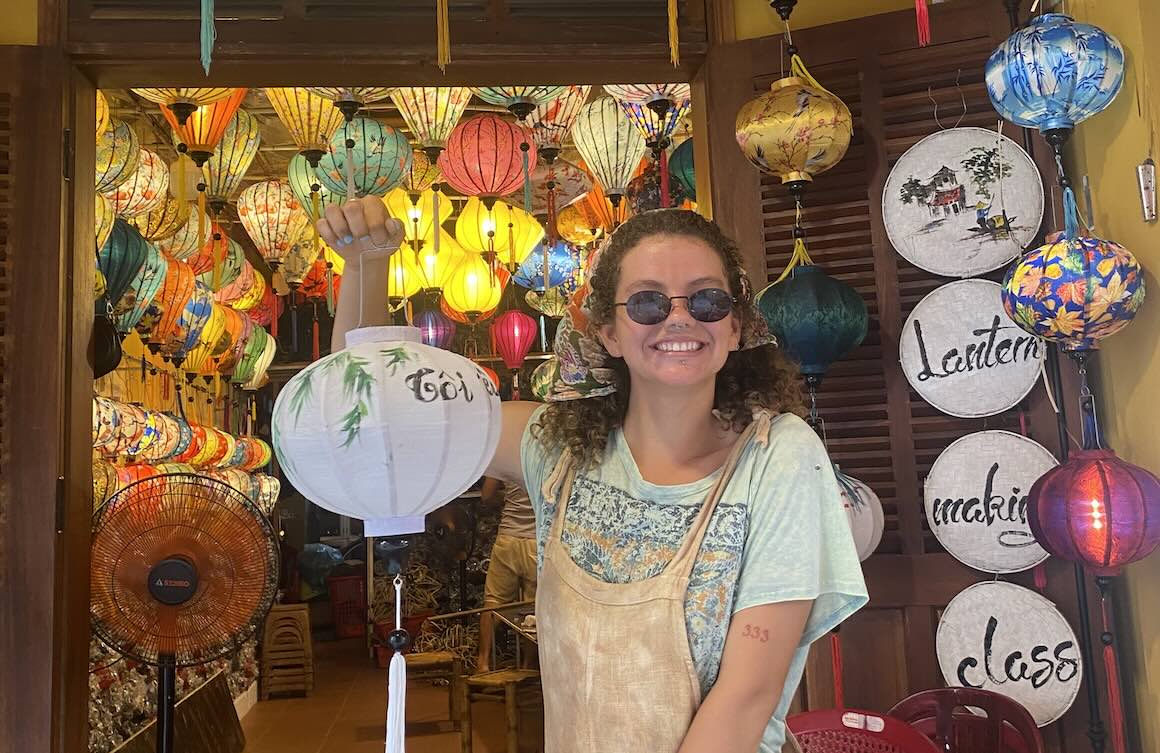 Audy holding a home made lantern in Hoi An, Vietnam.