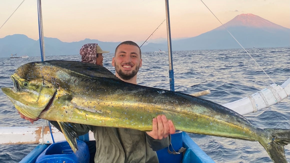 Man holding big Mahi Mahi in Amed, Bali.