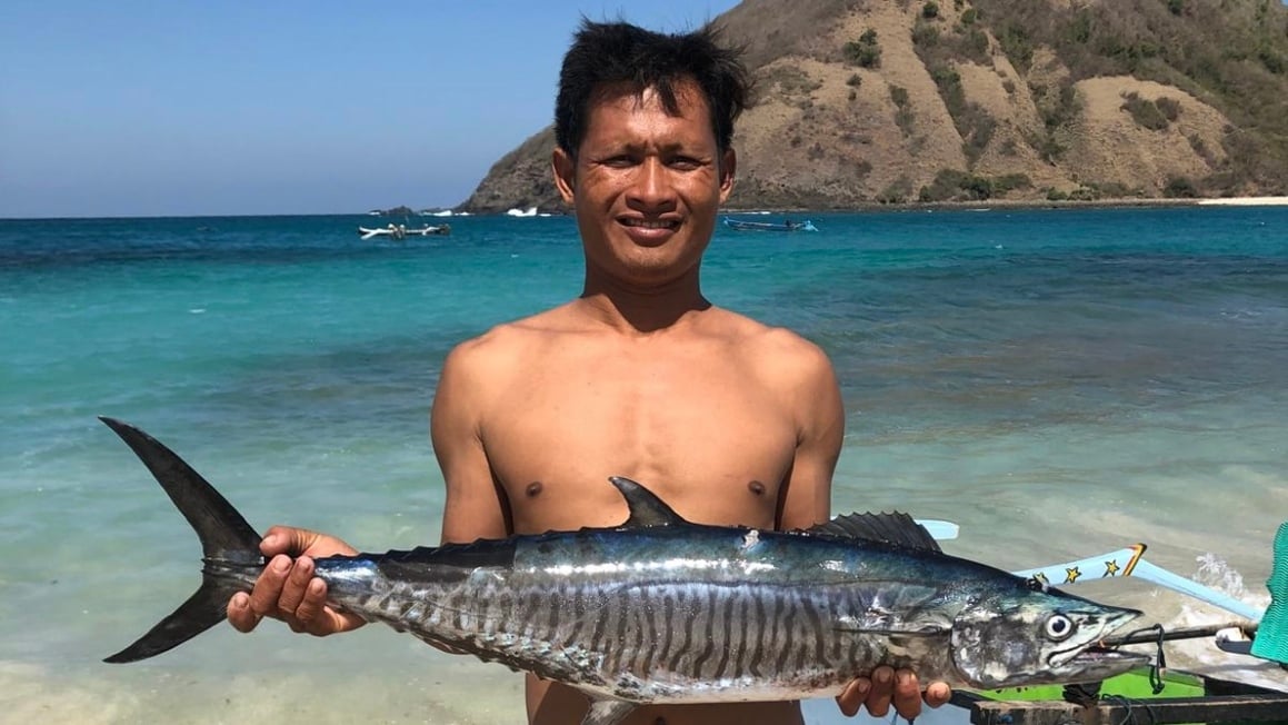 Wahoo fish held up by a local Indonesian man.