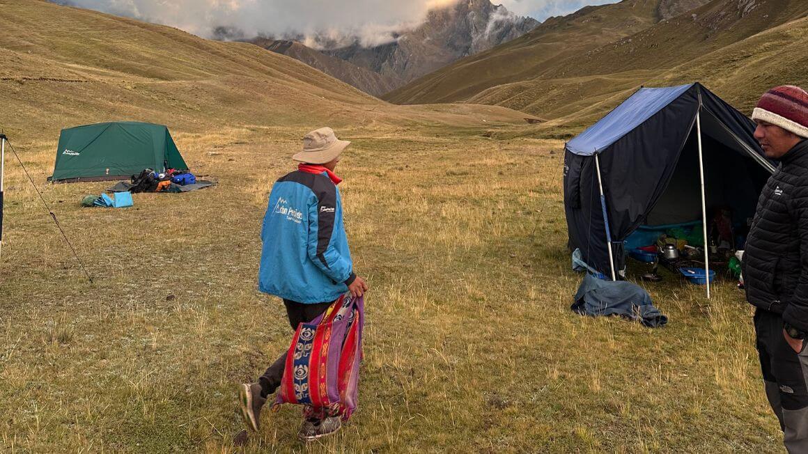 A campsite in a valley with mountains in the distance whilst on the Inca Trail in Peru