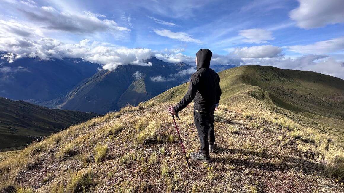 Will looking out over a mountainous landscape whilst hiking on the Inca Trail in Peru