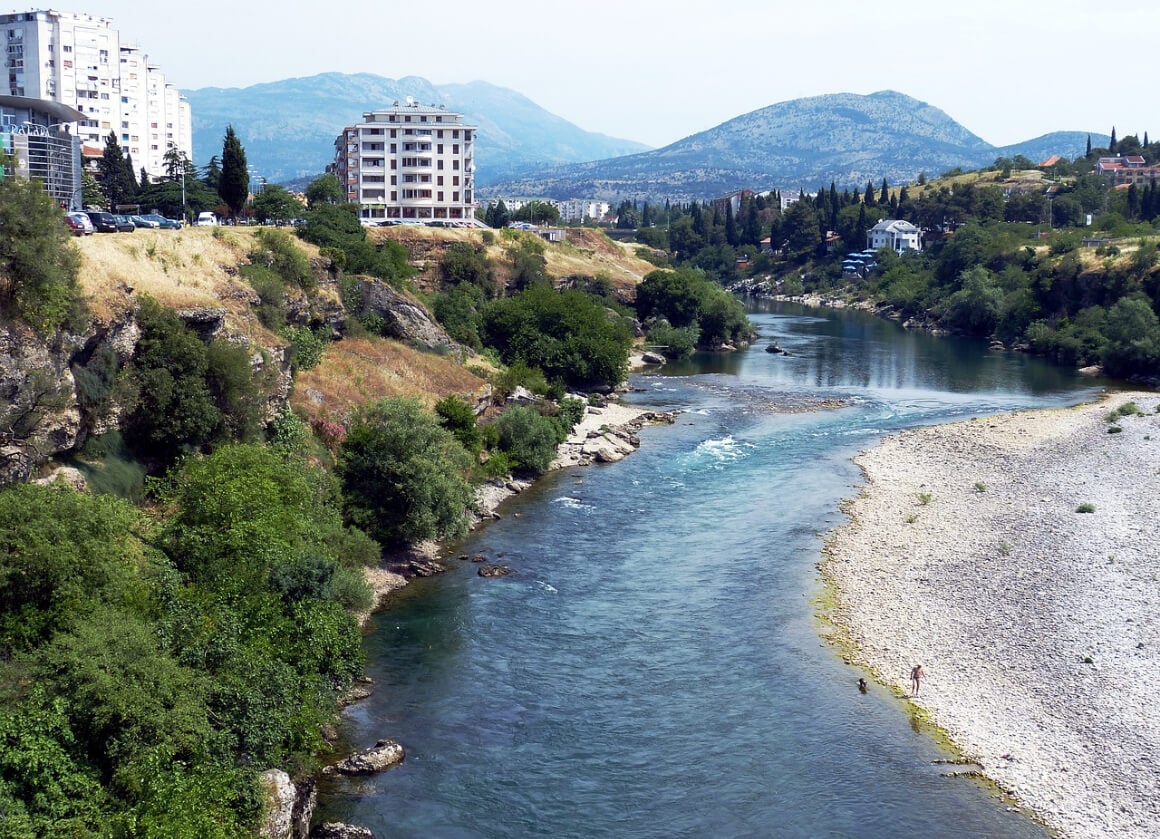 a view of a blue river flowing through Podgorica Montenegro