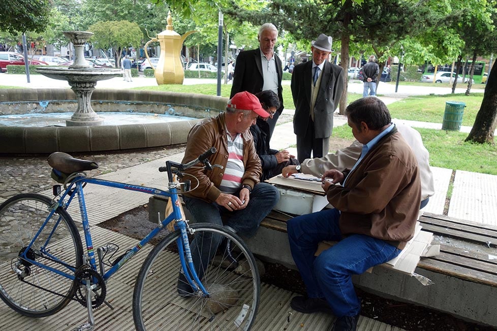 Men playing chess in a park in Tirana, Albania