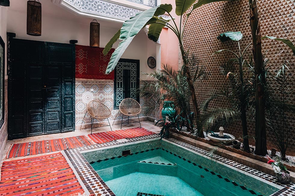 Looking towards a small plunge pool in the centre of an ornate Riad in Marrakesh, Morocco.