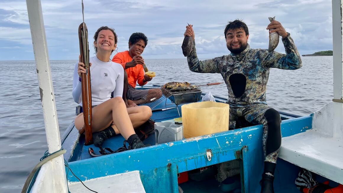 audy and friends about to cook the catch of the day on the boat