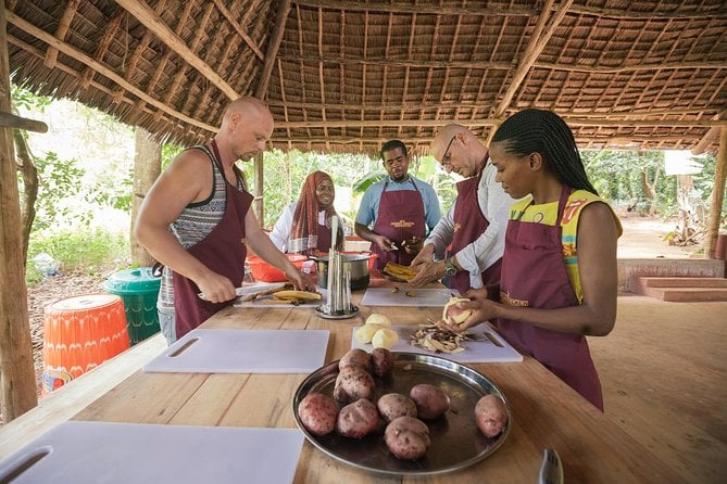 People workng around a table preparing food during a Farm to Table Cooking Class, zanzibar