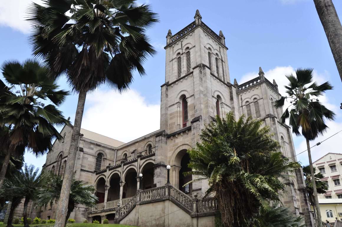 Cathedral in Suva Fiji surrounded by palm trees