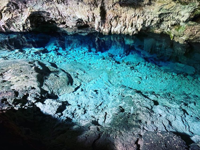 the blue water and limestone in the Kuza Cave, zanzibar