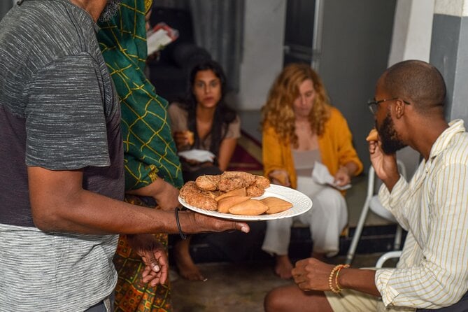 A person holding a plate of local food in zanzibar 