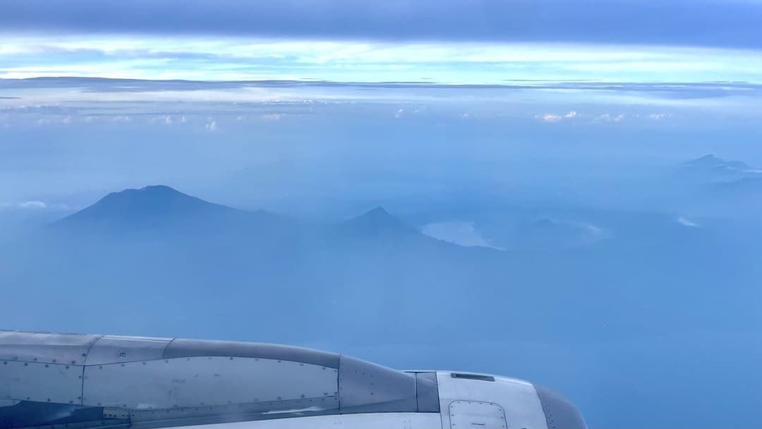 view out of plane window of indonesia